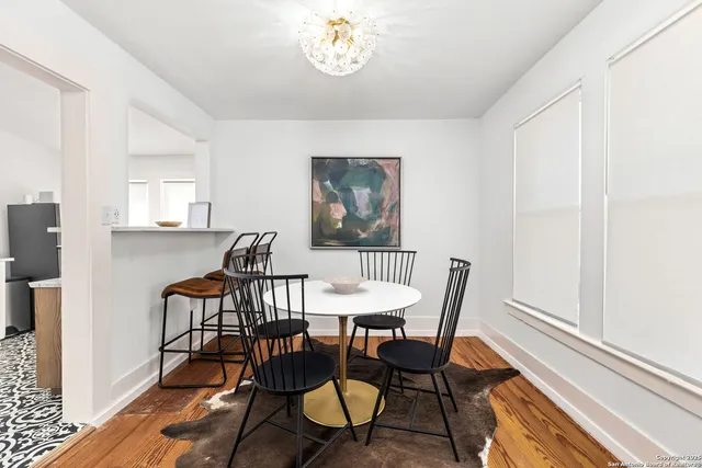 a dining room with furniture and window