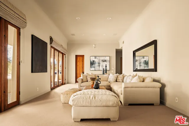 a spacious bedroom with a bed and a couch