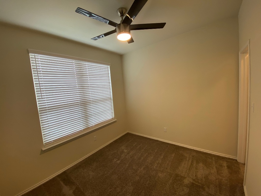 97 Quarryman Drive Hutto, TX 78634 - Photo 17 of 37 a view of an empty room with a window