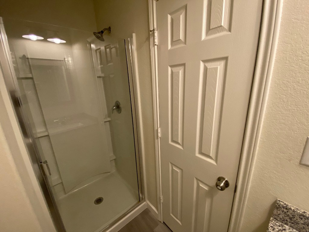 97 Quarryman Drive Hutto, TX 78634 - Photo 20 of 37 a bathroom with a shower