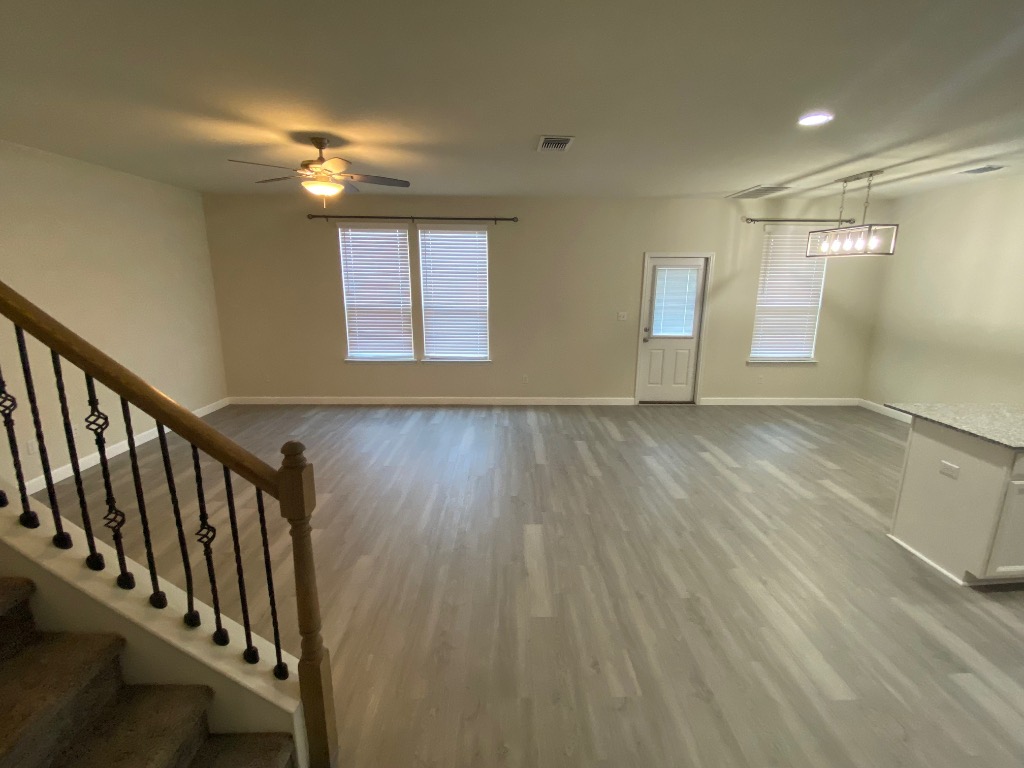 97 Quarryman Drive Hutto, TX 78634 - Photo 2 of 37 a view of an entryway with wooden floor