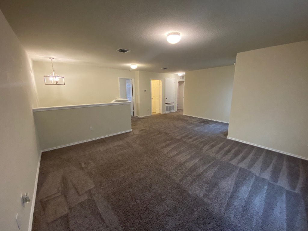 97 Quarryman Drive Hutto, TX 78634 - Photo 23 of 37 an empty room with windows