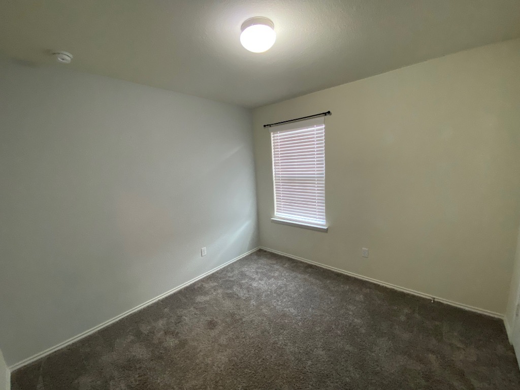 97 Quarryman Drive Hutto, TX 78634 - Photo 29 of 37 an empty room with a empty space and windows