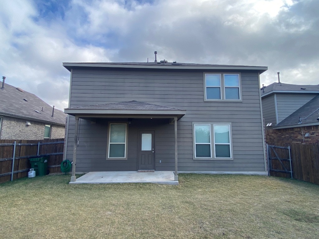 97 Quarryman Drive Hutto, TX 78634 - Photo 35 of 37 a front view of a house with a garden