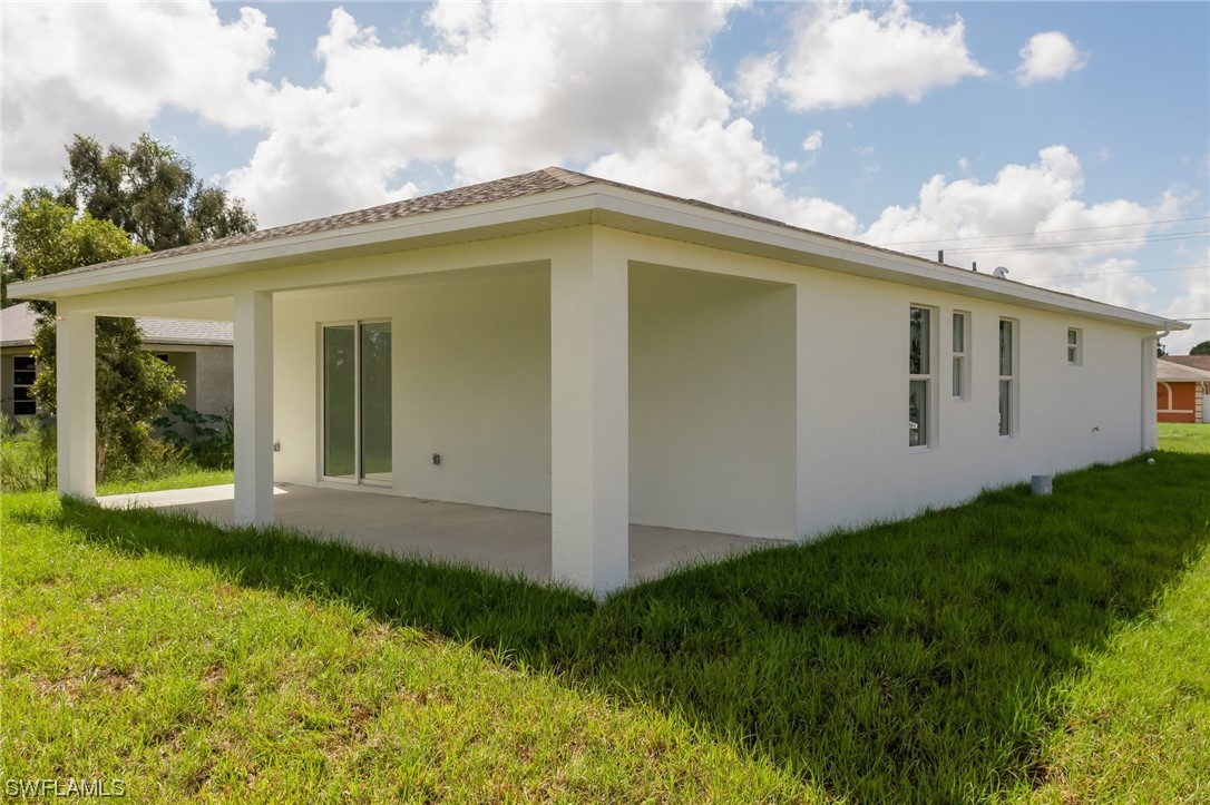 6017 Ruth Avenue North Lehigh Acres, FL 33971 - Photo 23 of 25 a view of a house with backyard