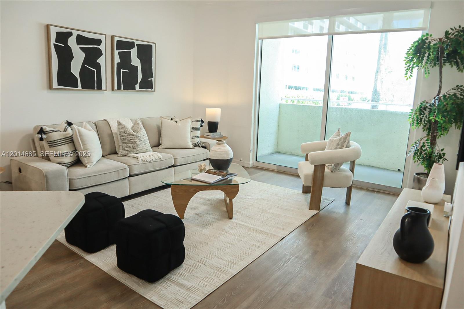 a living room with furniture and a large window