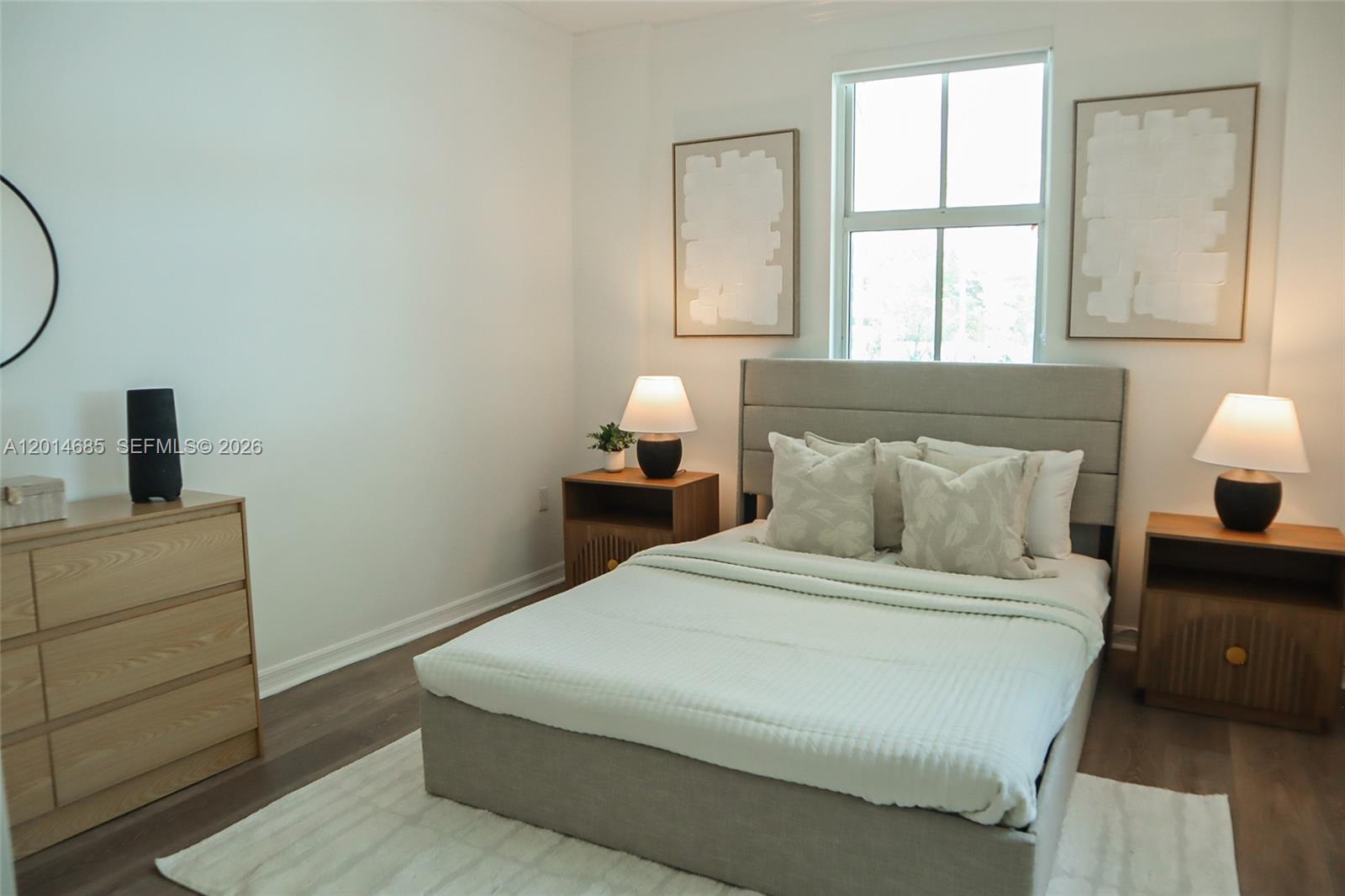 9172 Collins Avenue, Unit 212 Surfside, FL 33154 - Photo 12 of 23 a bedroom with a bed and window