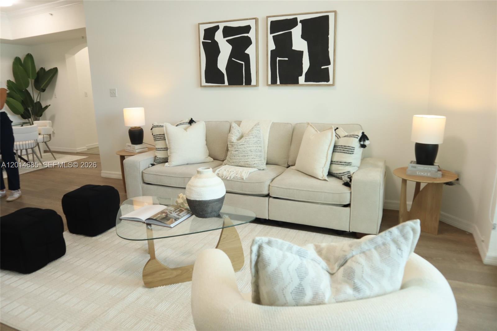 9172 Collins Avenue, Unit 212 Surfside, FL 33154 - Photo 14 of 23 a living room with furniture rug and lamp