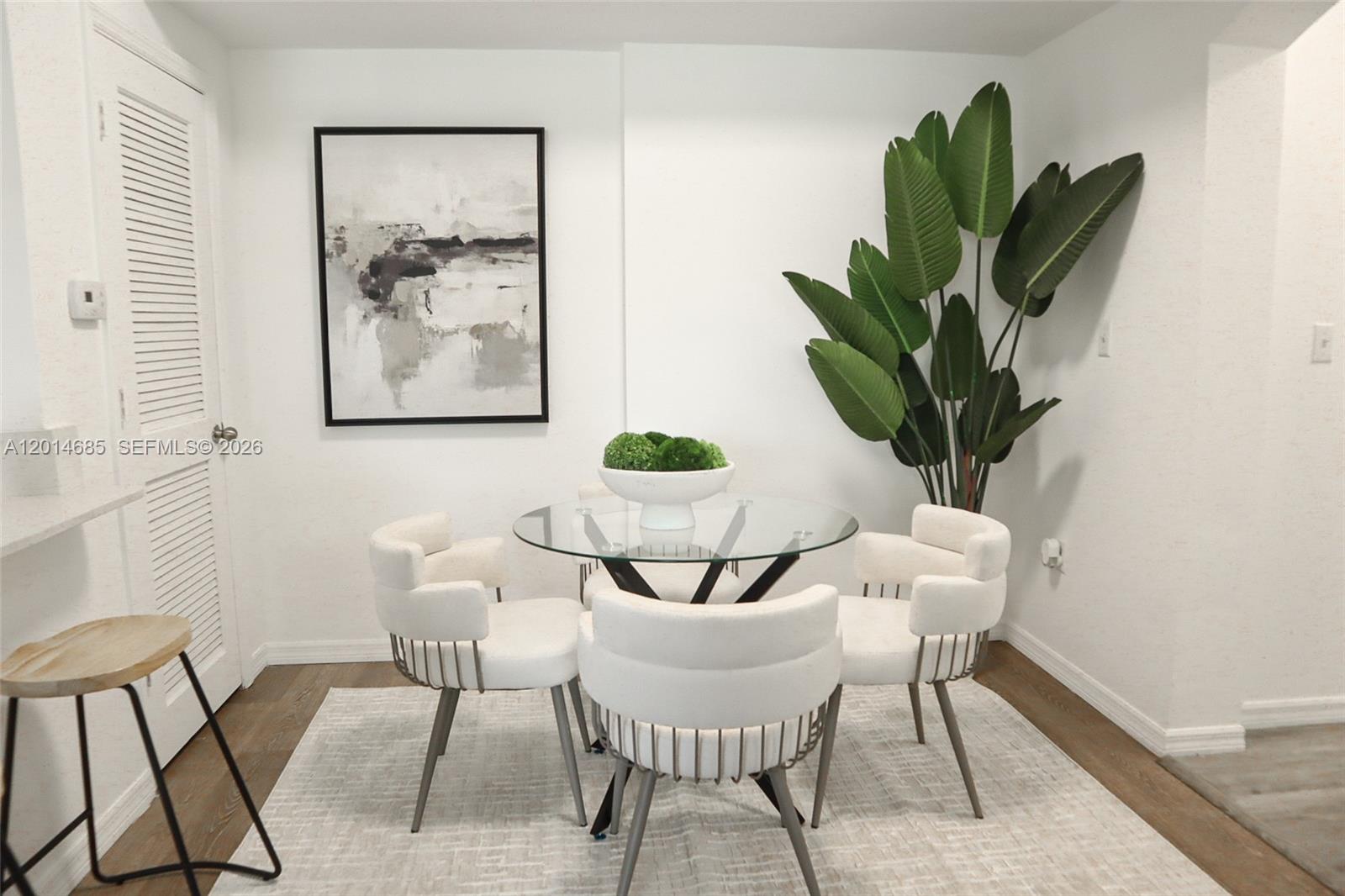 9172 Collins Avenue, Unit 212 Surfside, FL 33154 - Photo 16 of 23 a view of a dining room with furniture and wooden floor