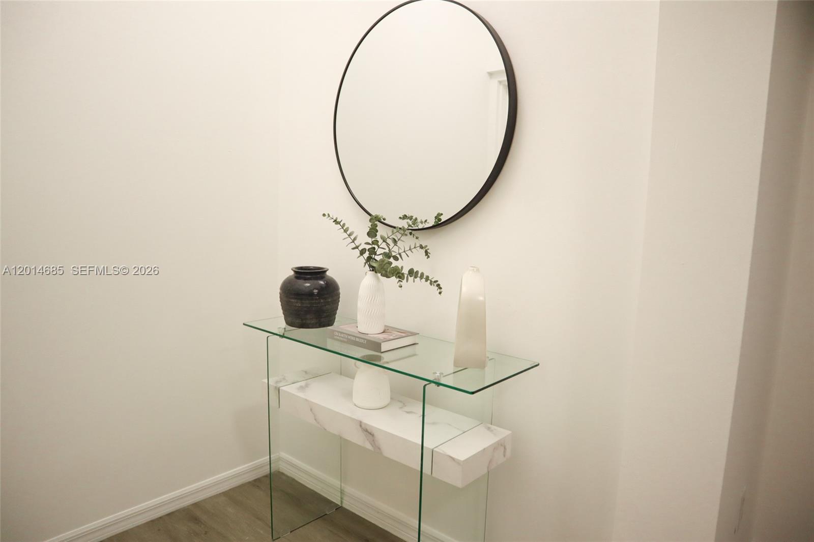 9172 Collins Avenue, Unit 212 Surfside, FL 33154 - Photo 4 of 23 a bathroom with a sink and a mirror