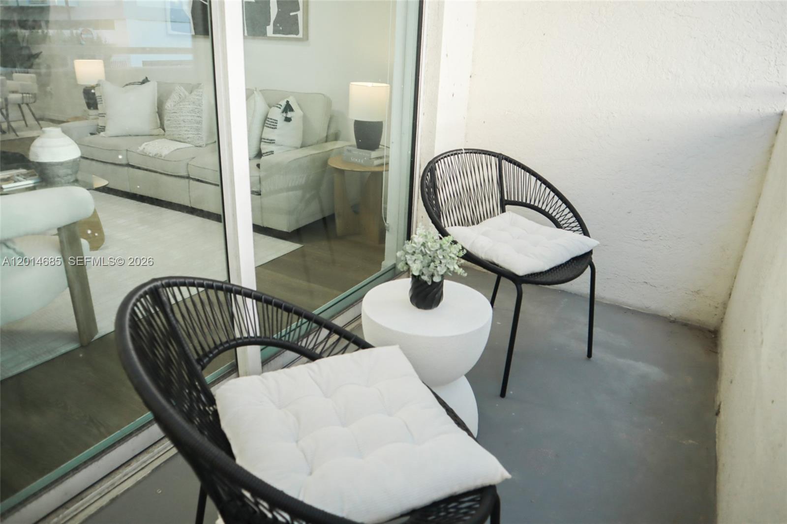 9172 Collins Avenue, Unit 212 Surfside, FL 33154 - Photo 8 of 23 a view of a dining room with furniture