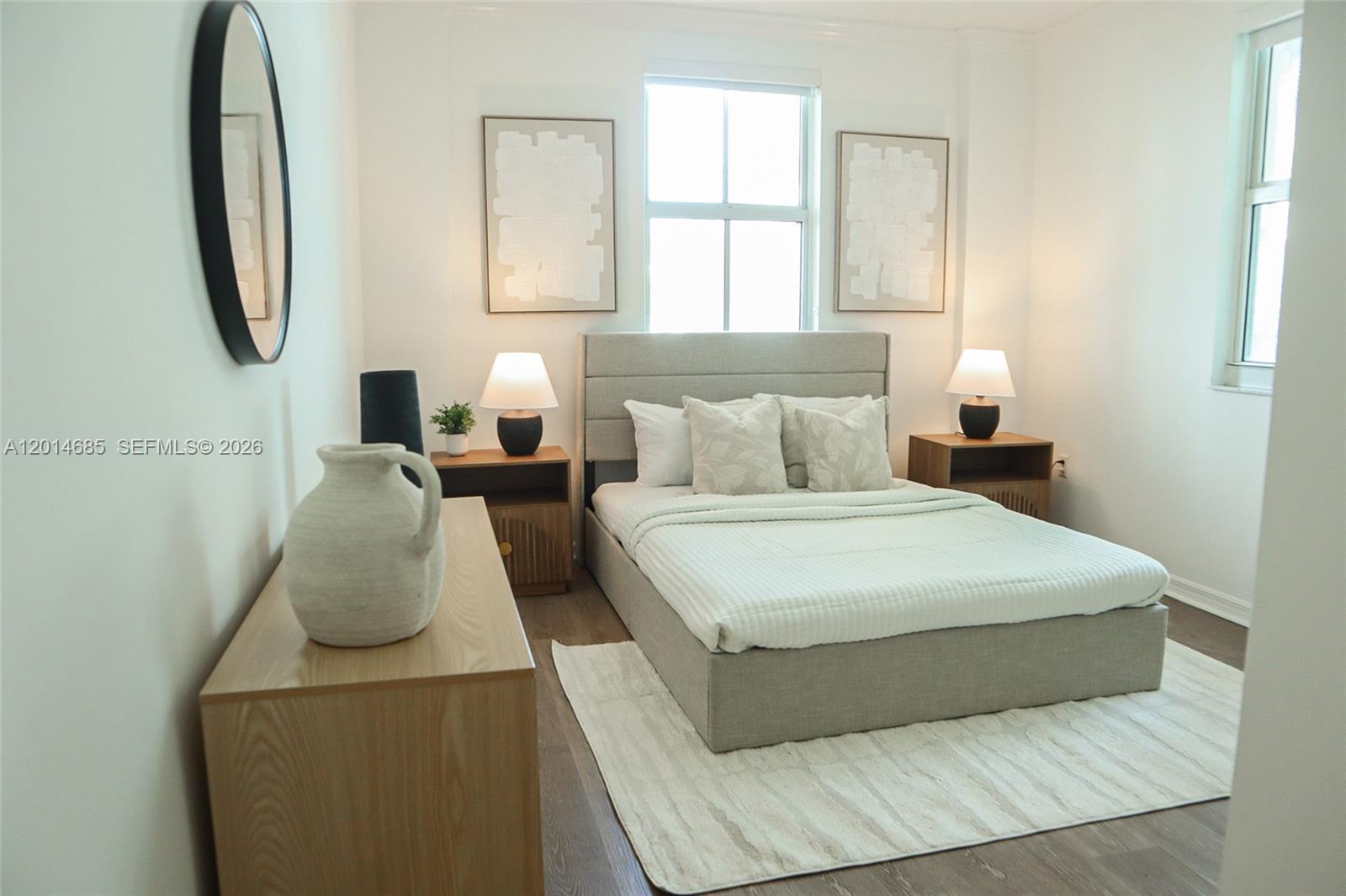 9172 Collins Avenue, Unit 212 Surfside, FL 33154 - Photo 10 of 23 a bedroom with bed and window