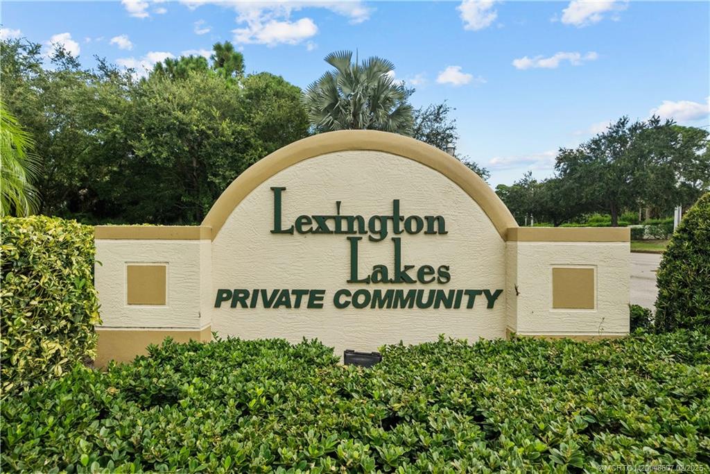 1580 Southeast Sheffield Terrace, Unit 101 Stuart, FL 34994 - Photo 1 of 39 a sign on the side of a building