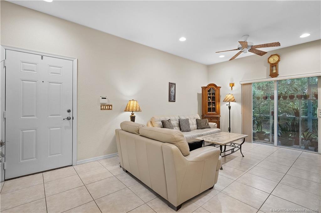 1580 Southeast Sheffield Terrace, Unit 101 Stuart, FL 34994 - Photo 11 of 39 a living room with furniture