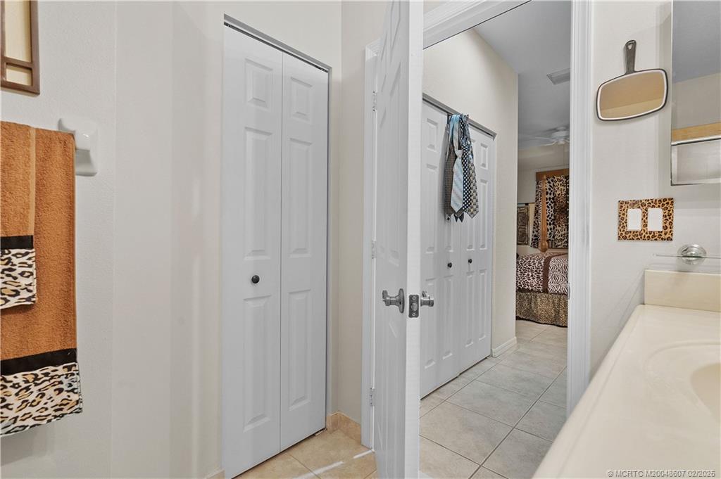 1580 Southeast Sheffield Terrace, Unit 101 Stuart, FL 34994 - Photo 18 of 39 a view of a bathroom from the hallway