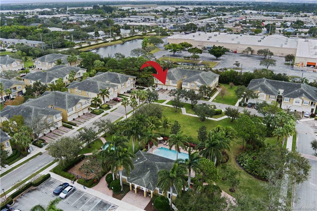 1580 Southeast Sheffield Terrace, Unit 101 Stuart, FL 34994 - Photo 35 of 39 an aerial view of a city with lots of residential buildings