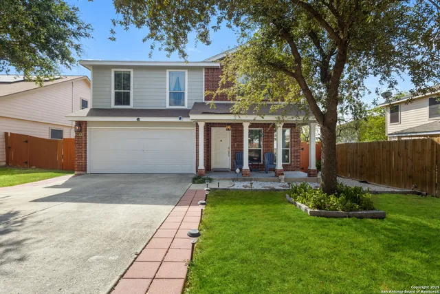 a view of a house with a yard