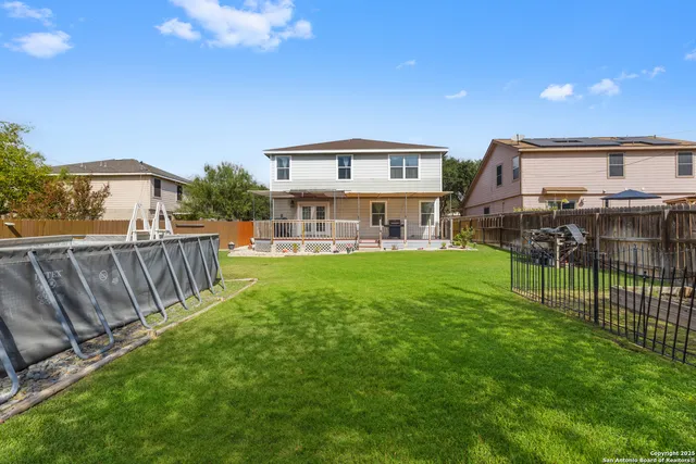 a view of a house with a yard and sitting area