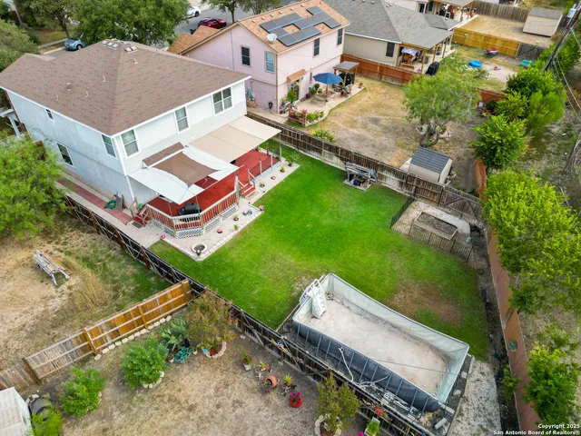 an aerial view of residential house with outdoor space and street view