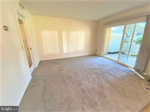 15070 Haslemere Court, Unit 262F Silver Spring, MD 20906 - Photo 9 of 31 LIVING RM FEATURES SLIDING GLASS DOOR TO PATIO