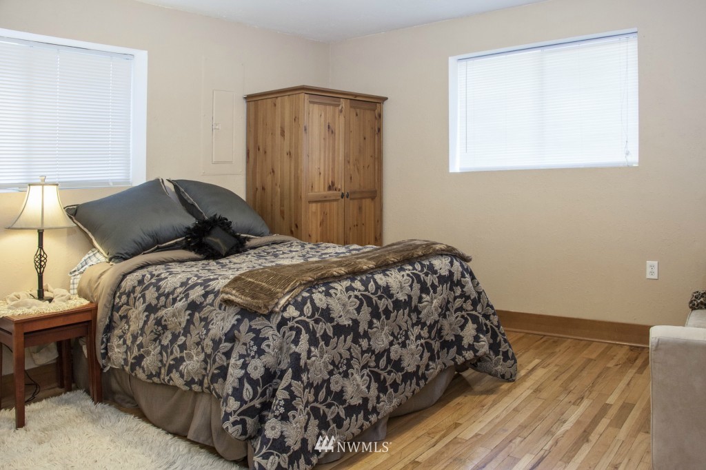 16623 Benson Road South Renton, WA 98055 - Photo 16 of 20 a bedroom with a bed and a window