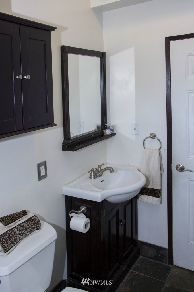 16623 Benson Road South Renton, WA 98055 - Photo 17 of 20 a bathroom with a sink toilet and mirror