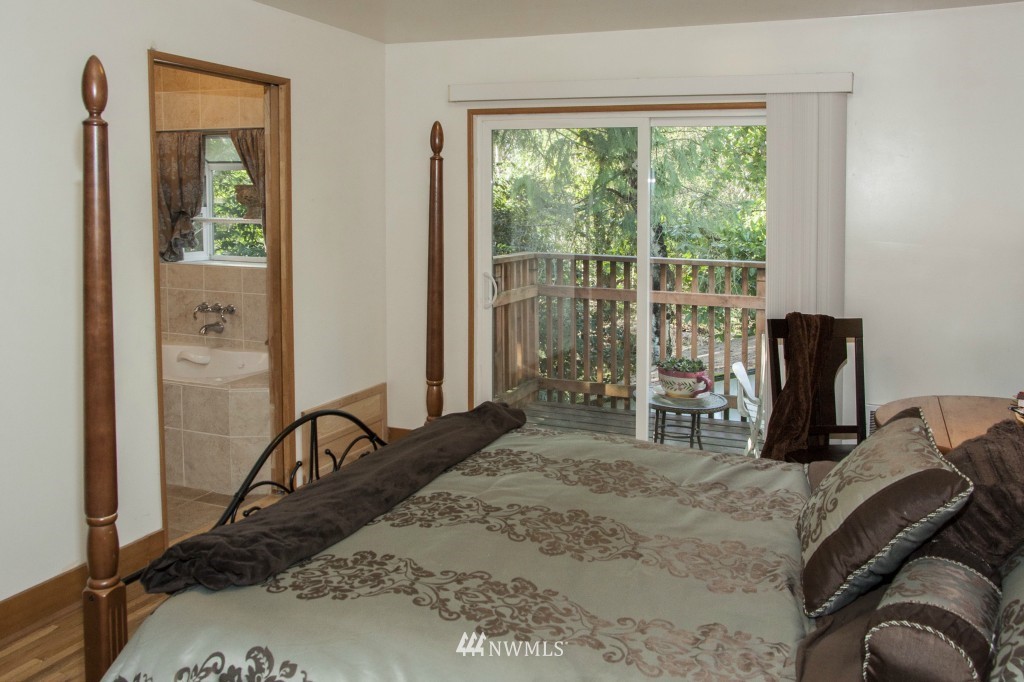16623 Benson Road South Renton, WA 98055 - Photo 18 of 20 a bed sitting in a bedroom next to a window