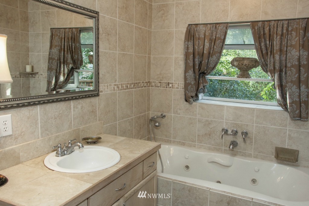 16623 Benson Road South Renton, WA 98055 - Photo 19 of 20 a bathroom with a sink and a bathtub