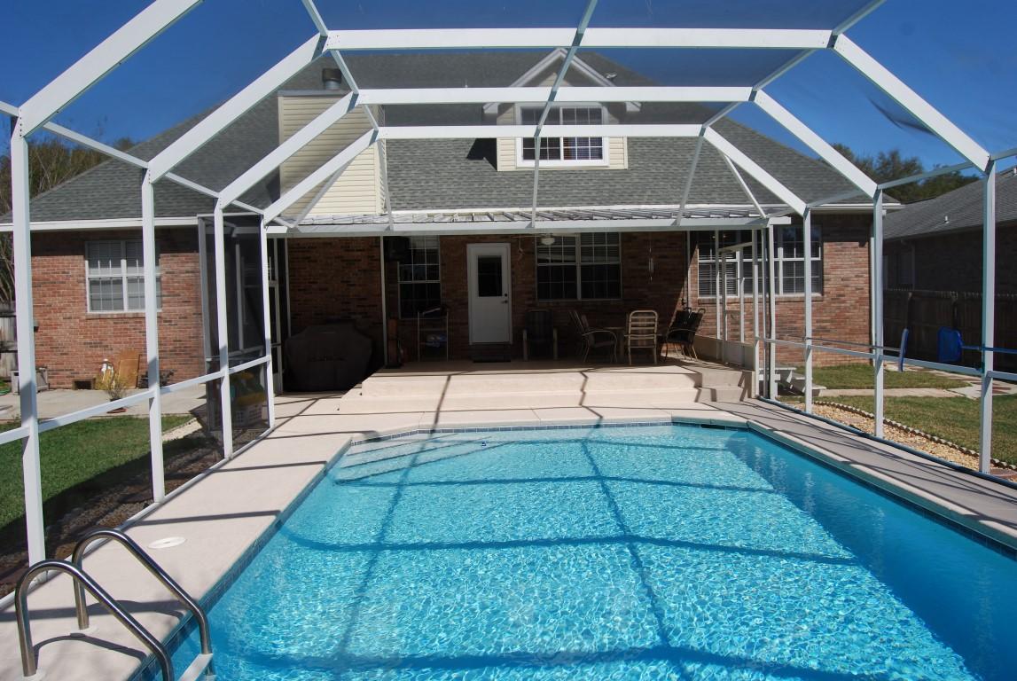 4454 Woodbridge Road Niceville, FL 32578 - Photo 4 of 27 Pool Cage & Patio