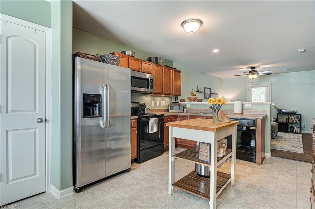 468 Ridgebrooke Drive High Point, NC 27265 - Photo 11 of 29 Open dining, kitchen, and living room with door to patio