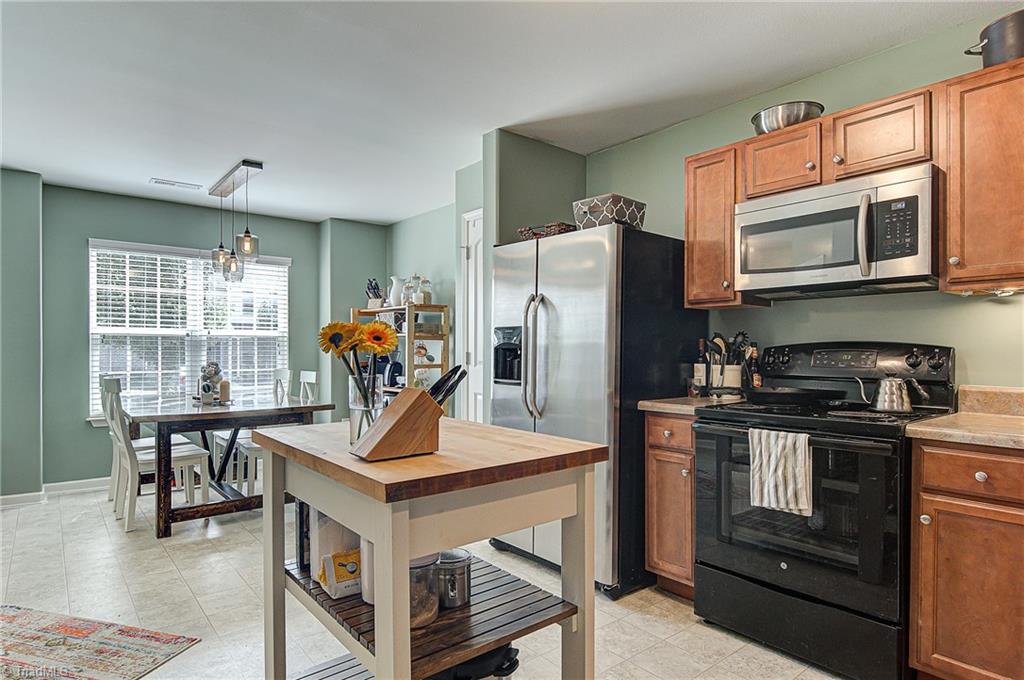 468 Ridgebrooke Drive High Point, NC 27265 - Photo 28 of 29 Open floor plan with dining, kitchen, and living room.