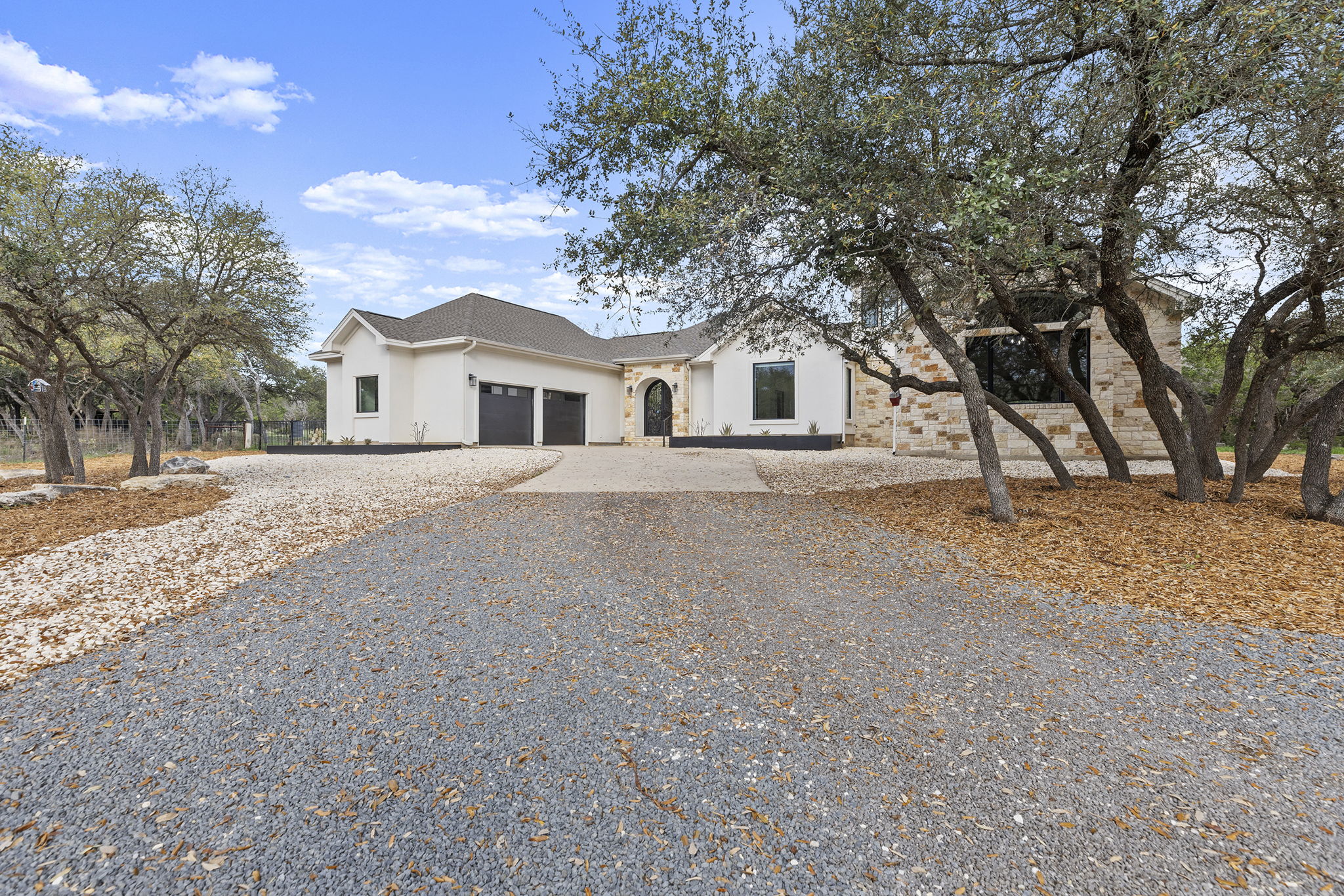 531 Windmill Ranch Road Georgetown, TX 78633 - Photo 1 of 1 View of front of property featuring a garage, driveway, stucco siding, and stone siding