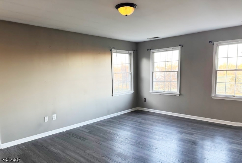 15 Opdyke Road Frenchtown, NJ 08825 - Photo 13 of 27 an empty room with wooden floor and windows