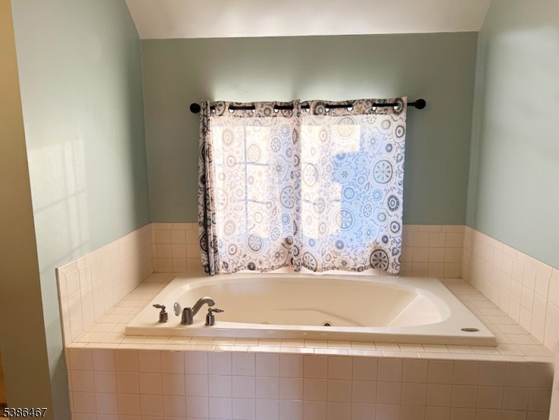 15 Opdyke Road Frenchtown, NJ 08825 - Photo 16 of 27 a bathroom with a bathtub and shower