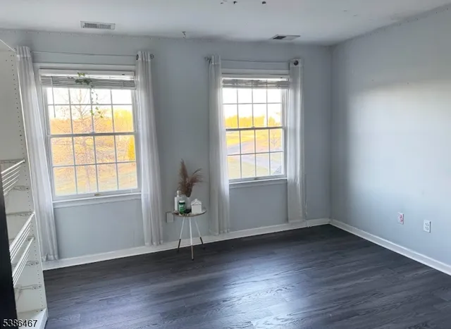 a living room with fireplace furniture and a chandelier