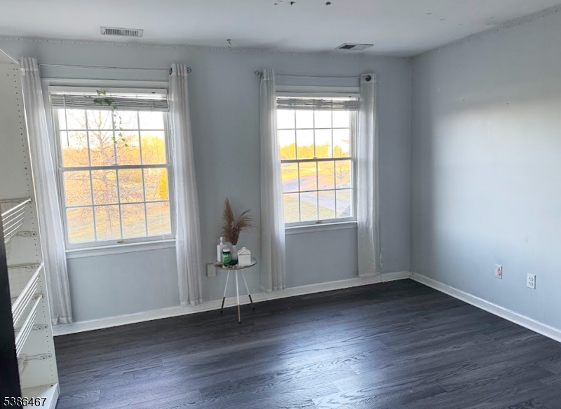 15 Opdyke Road Frenchtown, NJ 08825 - Photo 19 of 27 an empty room with wooden floor and windows