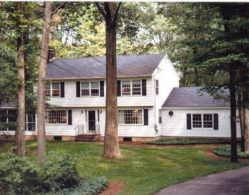 32 Nutmeg Ridge Ridgefield, CT 06877 - Photo 1 of 1 a front view of a house with a garden