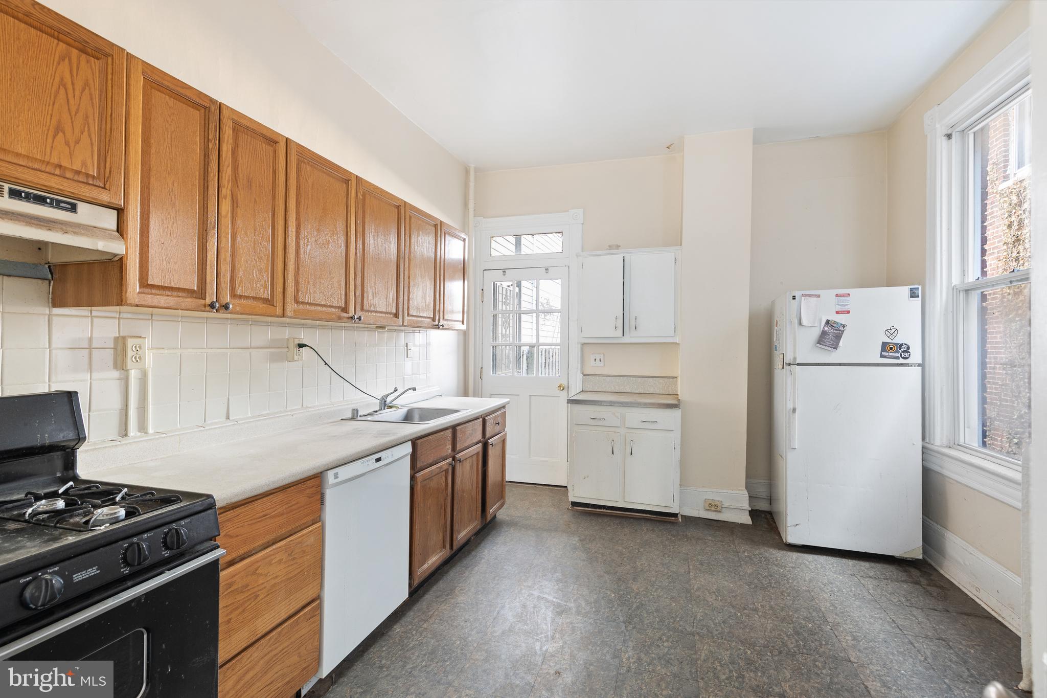 330 4th Street Southeast Washington, DC 20003 - Photo 7 of 14 a kitchen with cabinets appliances and a window