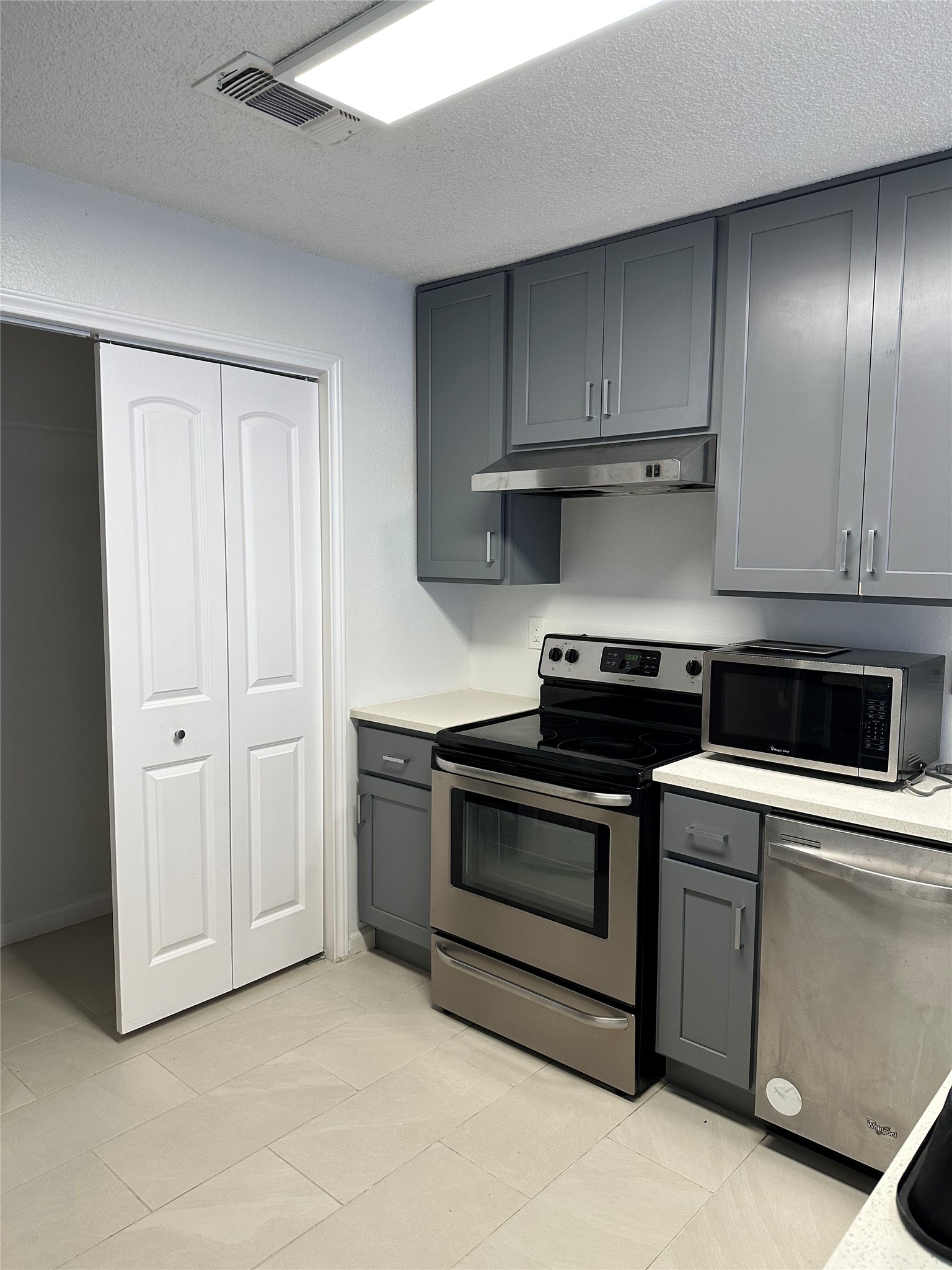 4204 Duval Road, Unit B Austin, TX 78759 - Photo 1 of 1 Kitchen featuring stainless steel appliances and soft close vanity.