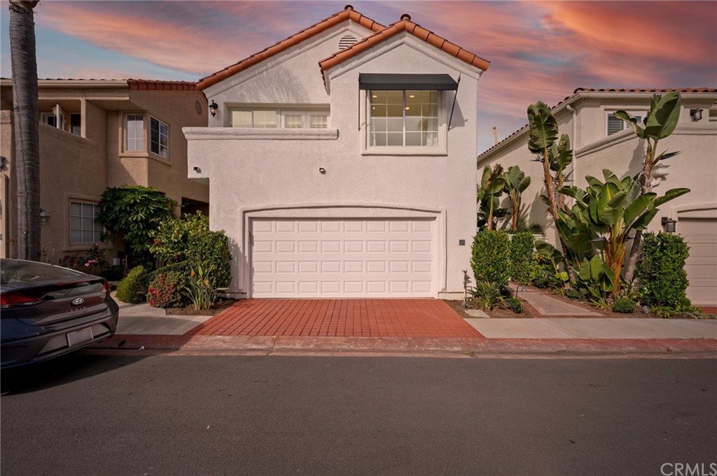 17 St John Dana Point, CA 92629 - Photo 1 of 28 a front view of a house with a yard and garage