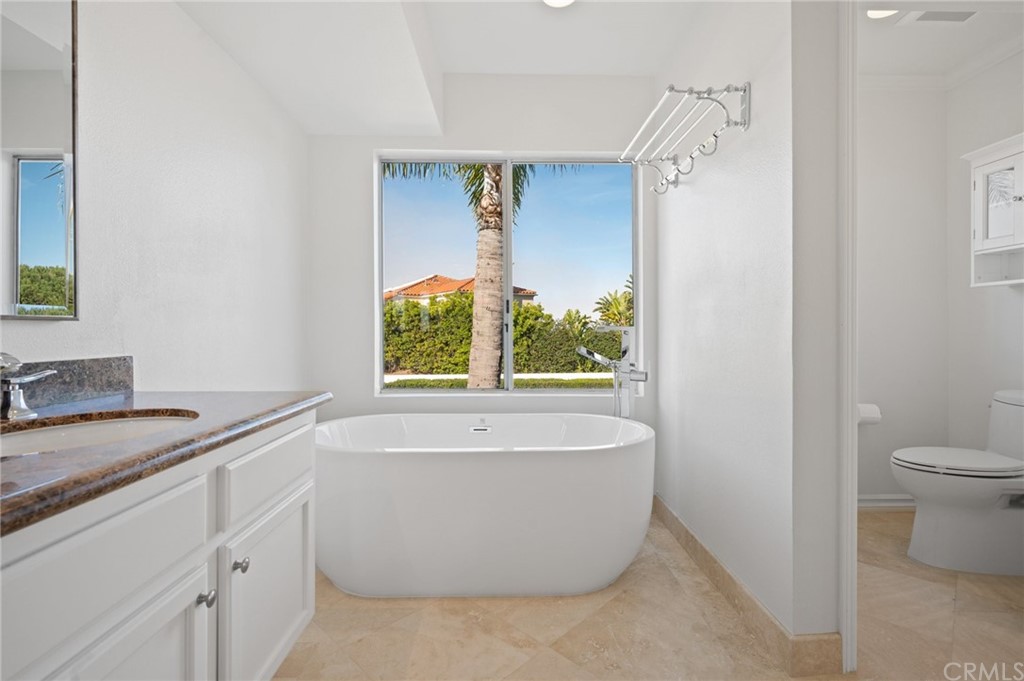 17 St John Dana Point, CA 92629 - Photo 17 of 28 a bath room with a sink and a bath tub