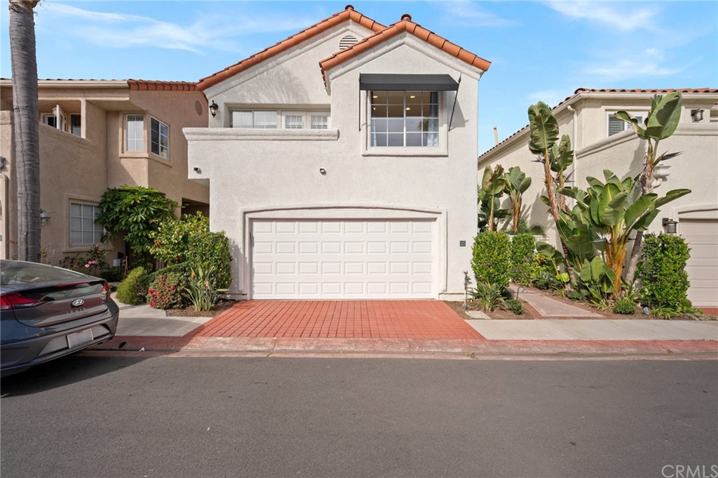 17 St John Dana Point, CA 92629 - Photo 2 of 28 a front view of a house with a yard and garage