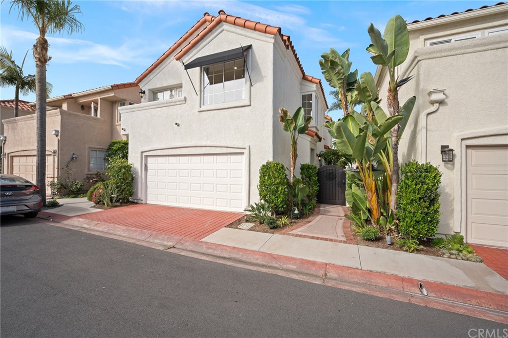 17 St John Dana Point, CA 92629 - Photo 3 of 28 a front view of a house with a yard and garage