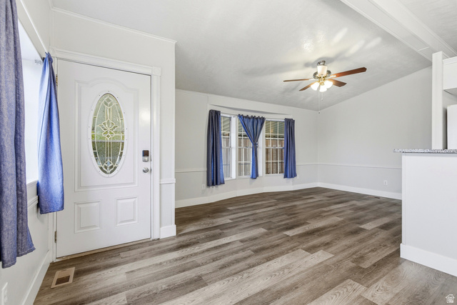 150 West 7500th South, Unit 55 Midvale, UT 84047 - Photo 10 of 28 Foyer featuring wood finished floors, ceiling fan, and vaulted ceiling with beams