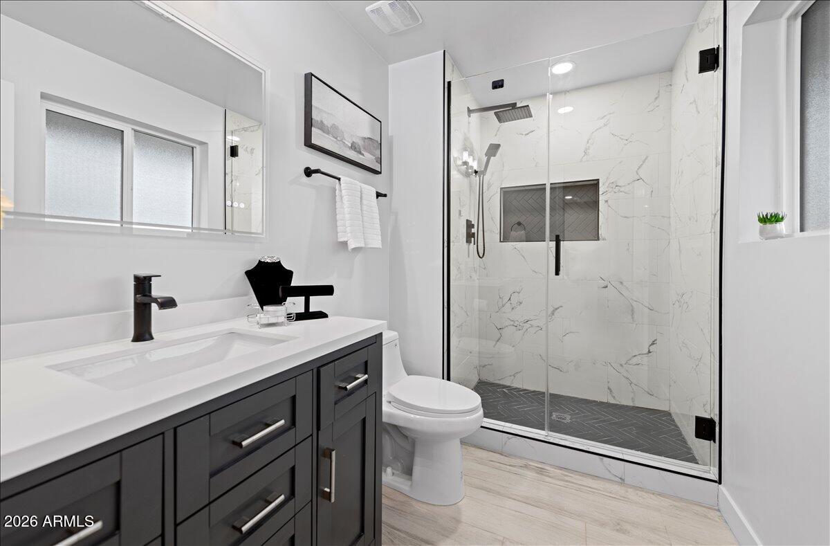 11615 North 30th Street Phoenix, AZ 85028 - Photo 20 of 37 a bathroom with a sink a toilet and shower