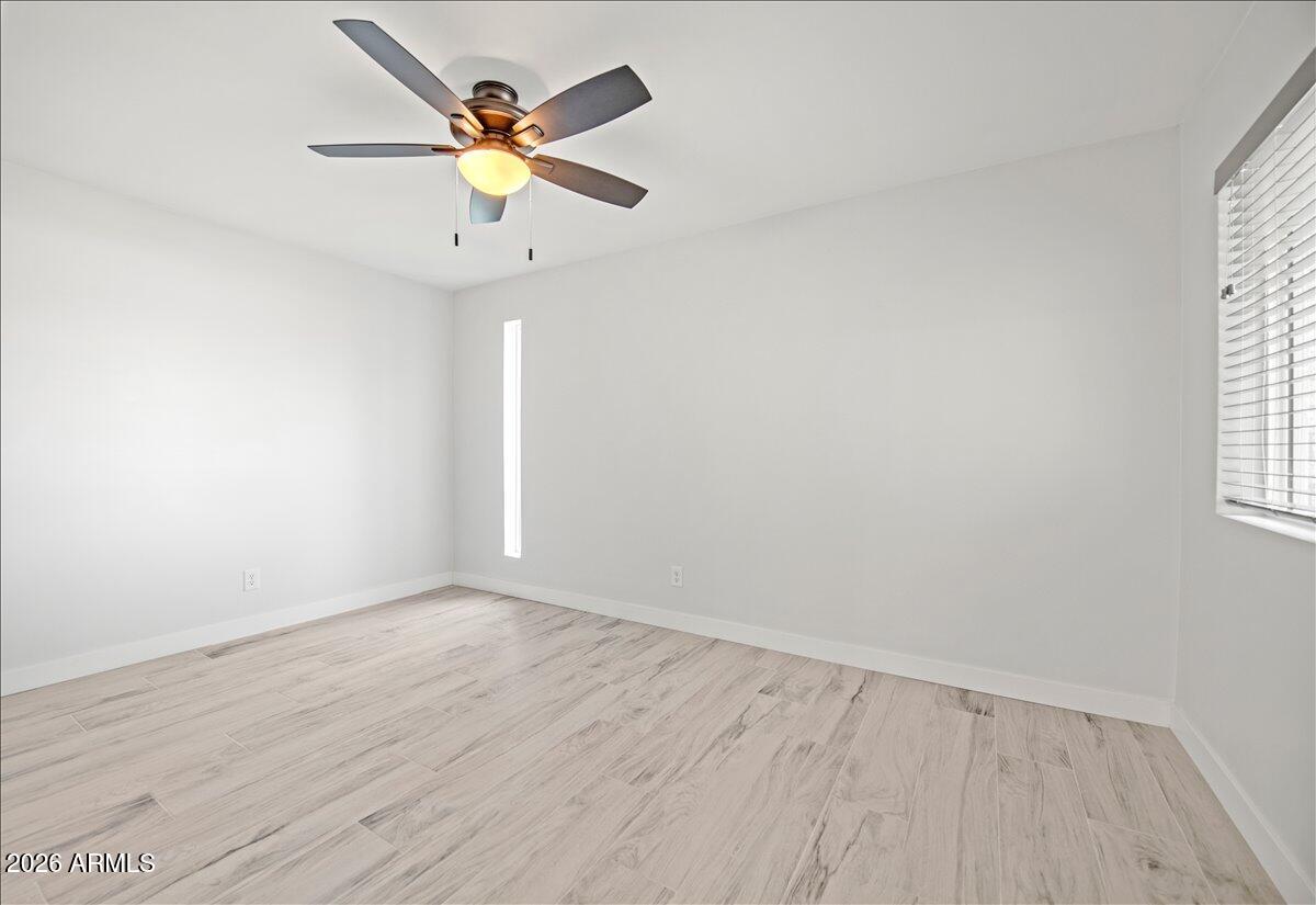 11615 North 30th Street Phoenix, AZ 85028 - Photo 22 of 37 wooden floor in an empty room with a window