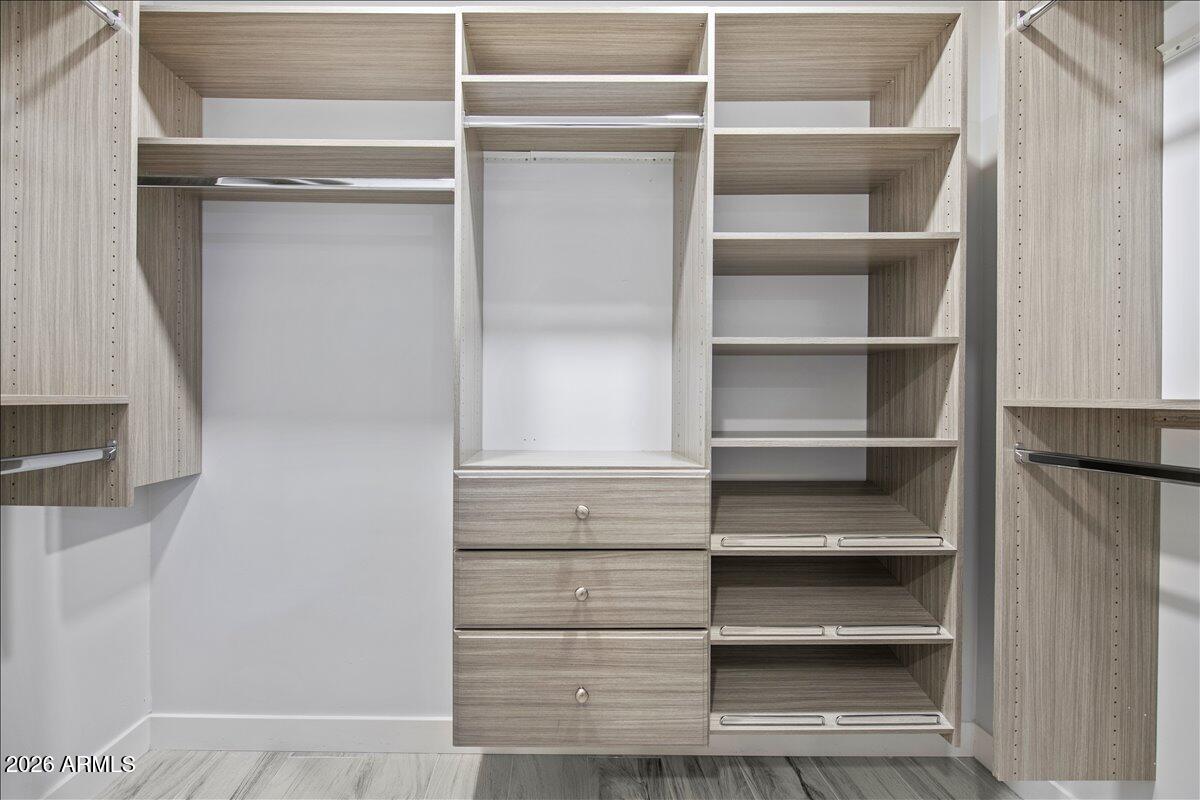 11615 North 30th Street Phoenix, AZ 85028 - Photo 25 of 37 a view of walk in closet with empty racks