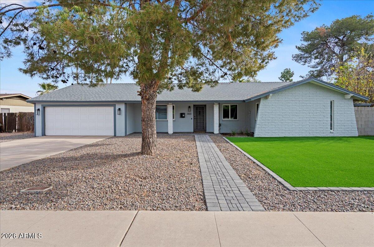 11615 North 30th Street Phoenix, AZ 85028 - Photo 2 of 37 front view of a house with a yard