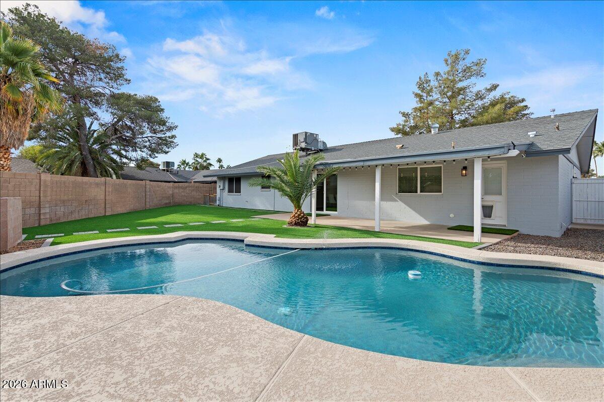11615 North 30th Street Phoenix, AZ 85028 - Photo 30 of 37 a view of swimming pool with outdoor seating and yard