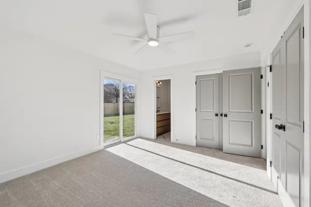 a kitchen with granite countertop stainless steel appliances and wooden cabinets